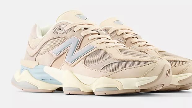 View of tan New Balance shoes.